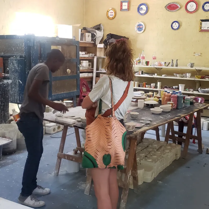 Potter demonstrating at the ceramic studio