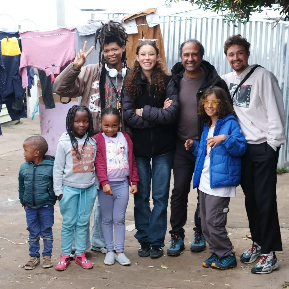 Family group photo in a township backyard