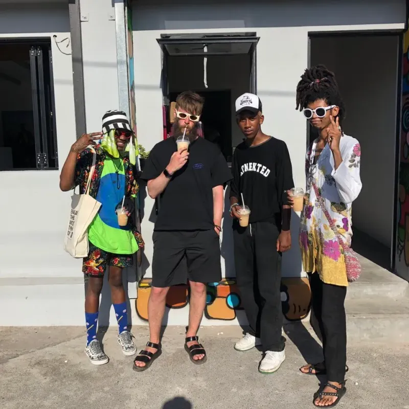 Guests holding smoothies outside the coffee shop