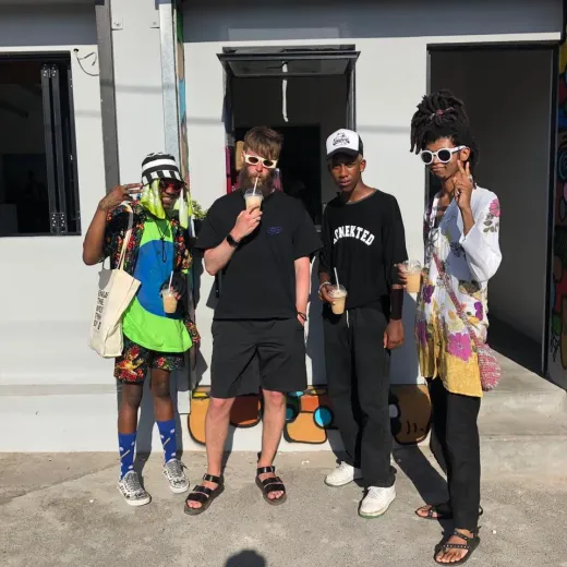 Guests holding smoothies outside the coffee shop