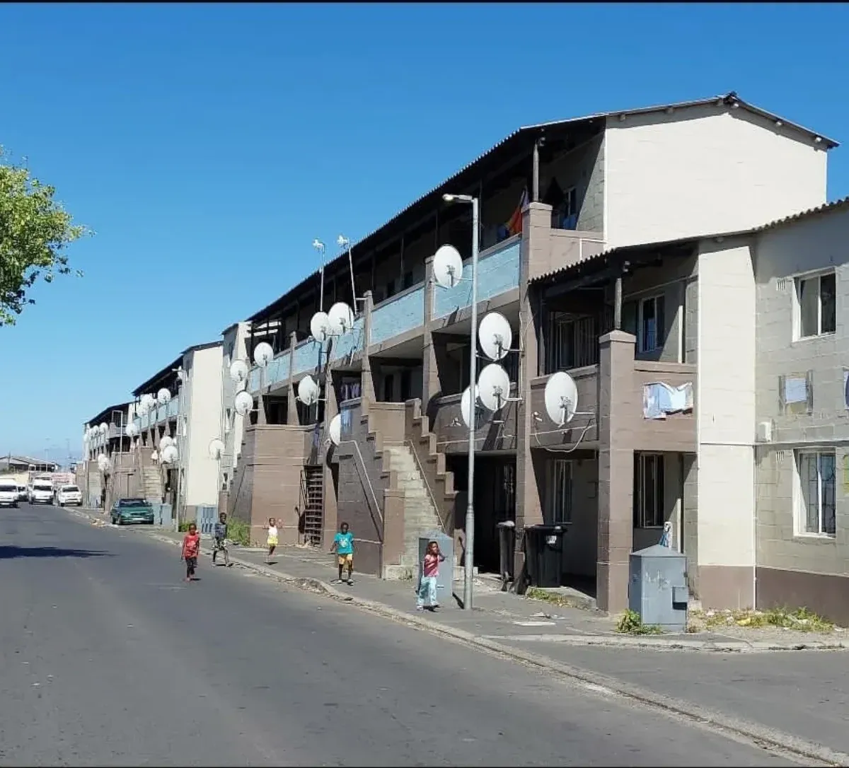 A Langa street lined with flats and satellite dishes